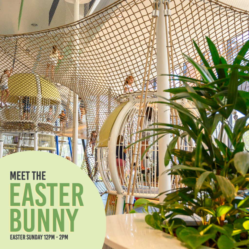 Children playing in an indoor playground with climbing nets and pods; text overlay reads "Meet the Easter Bunny, Easter Sunday 12PM - 2PM.