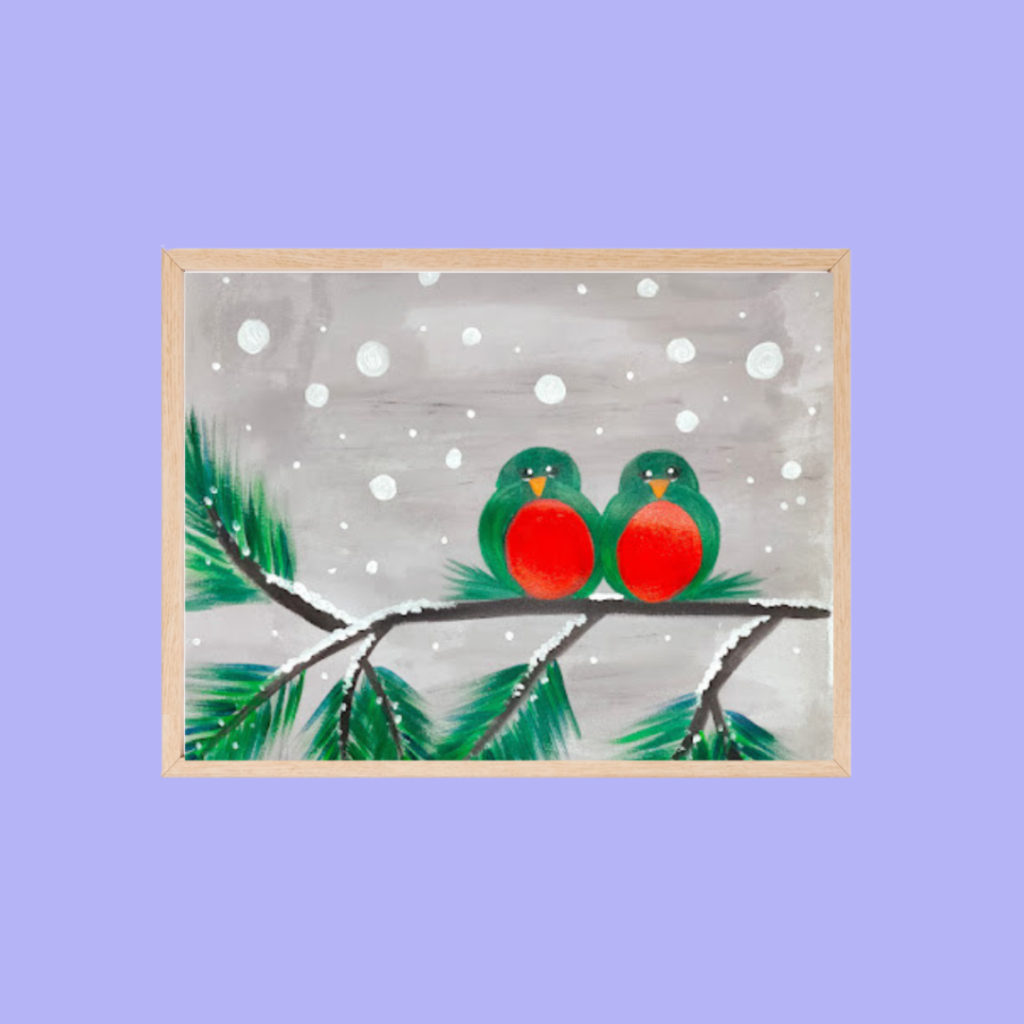A framed painting of two red-breasted birds sitting on a snowy pine branch with a gray sky and falling snow in the background.