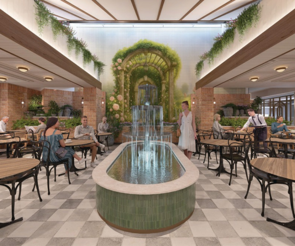 Spacious indoor café with a central water fountain, greenery, wall mural of a garden, and several people seated at tables or walking.